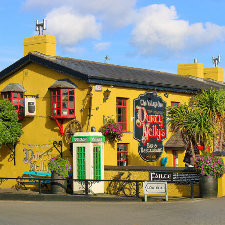 a yellow building with a sign on the front