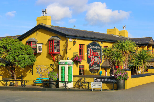 a yellow building with a sign on the front