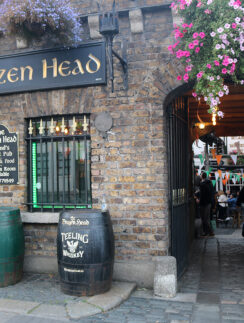 a building with flowers from the front