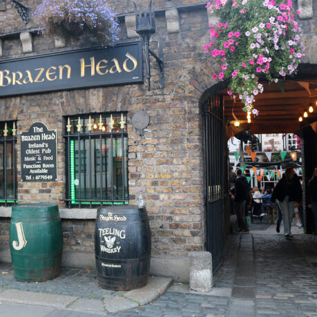 a building with flowers from the front