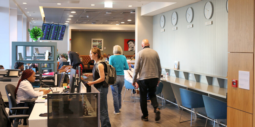 people in a room with people and computers