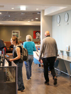 people in a room with people and computers