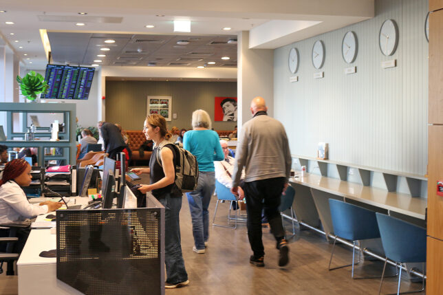 people in a room with people and computers