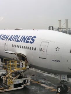a large airplane being loaded with cargo