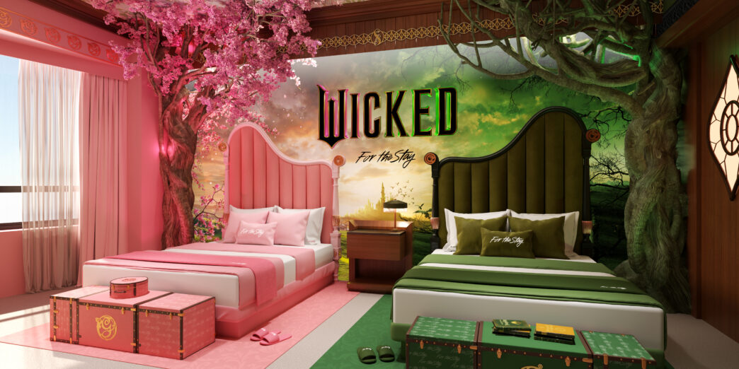 a room with two beds and a tree