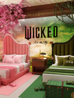 a room with two beds and a tree