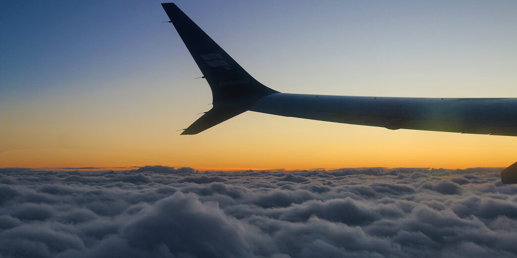 the wing of an airplane above clouds