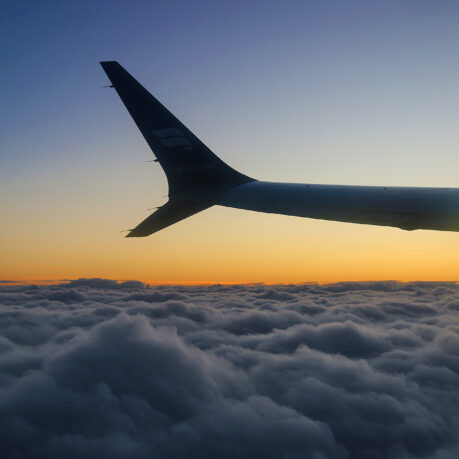 the wing of an airplane above clouds