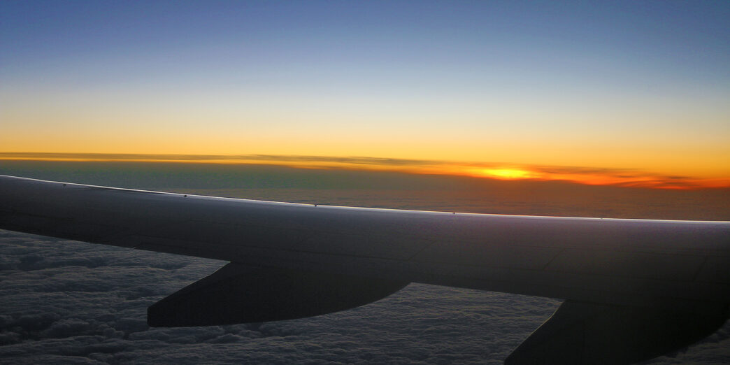 an airplane wing in the sky