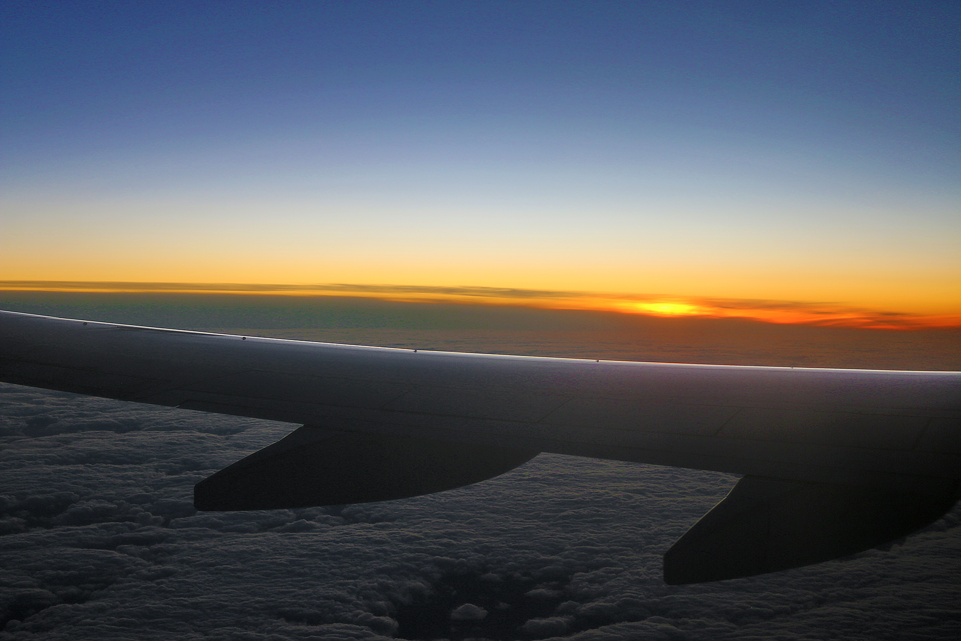 an airplane wing in the sky