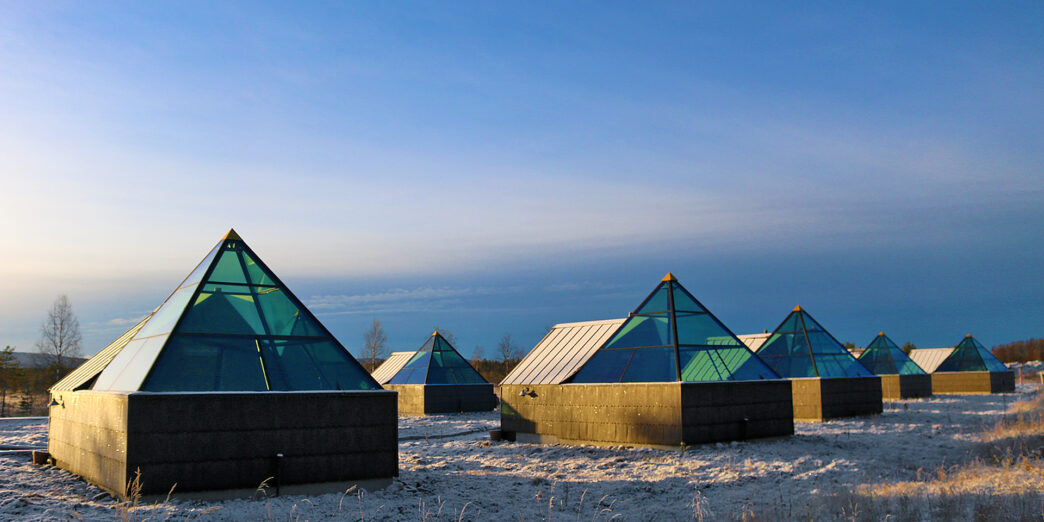 a group of buildings with glass windows