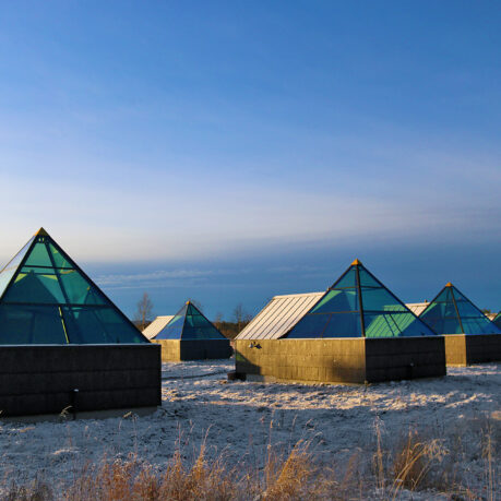 a group of buildings with glass windows