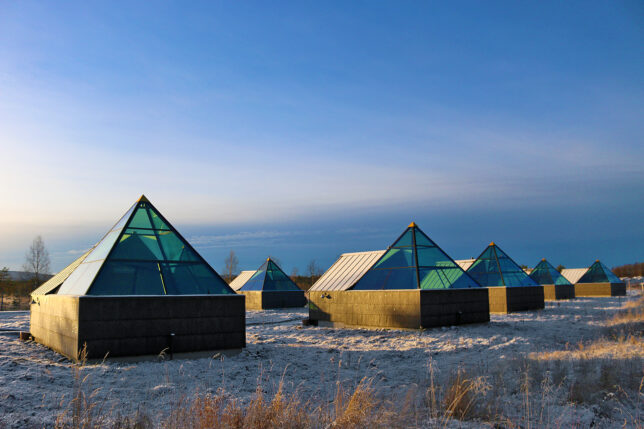 a group of buildings with glass windows