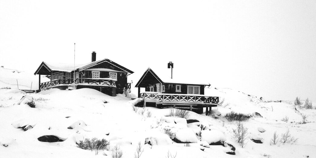 a house on a snowy hill