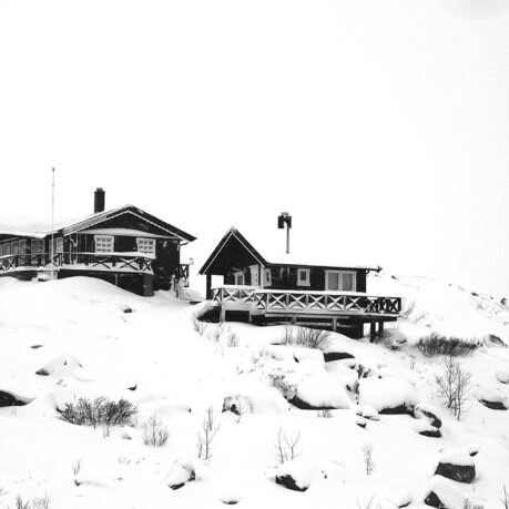 a house on a snowy hill