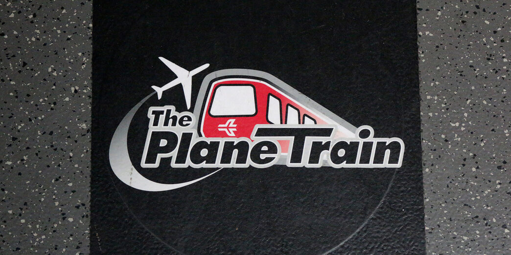 a black square with a red and white logo on it