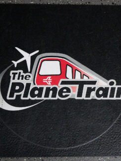 a black square with a red and white logo on it