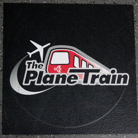 a black square with a red and white logo on it