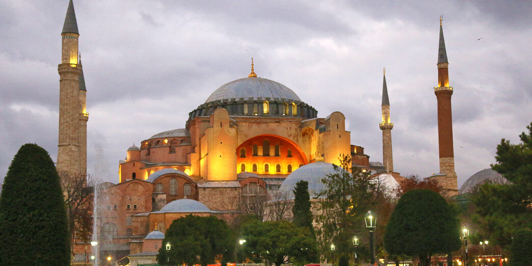 a large building with a dome and towers with Hagia Sophia in the background