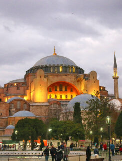 a large building with a dome and towers with Hagia Sophia in the background