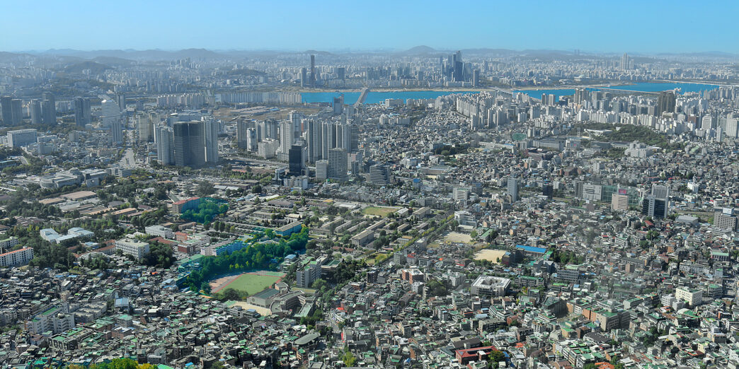 a city with many buildings and trees