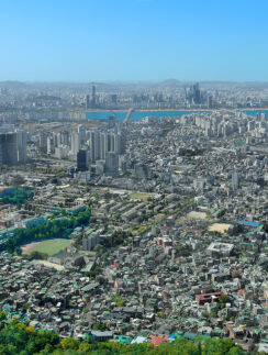 a city with many buildings and trees