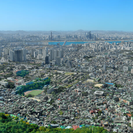 a city with many buildings and trees