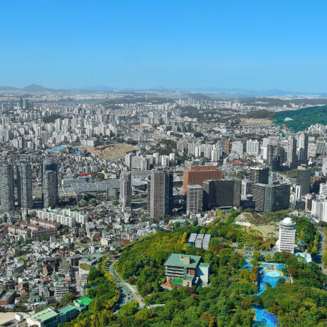 a city with many buildings and trees