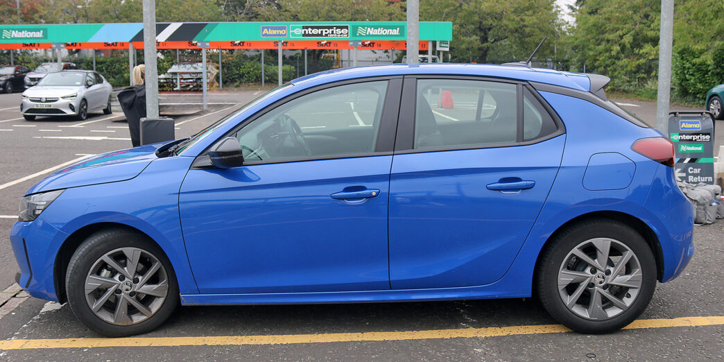 a blue car parked in a parking lot