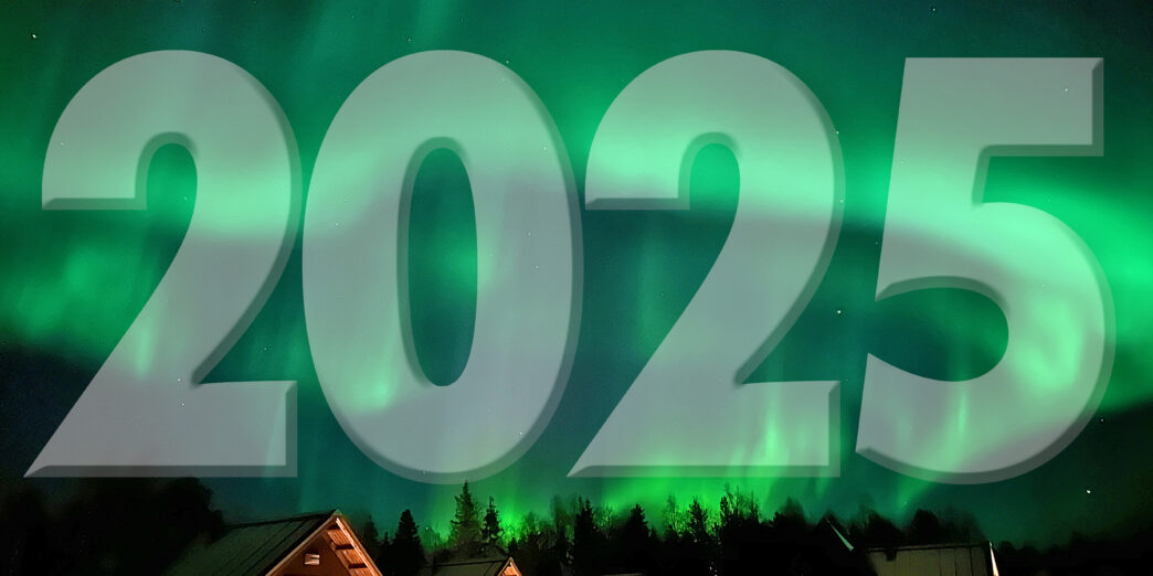 a green aurora borealis over a group of houses
