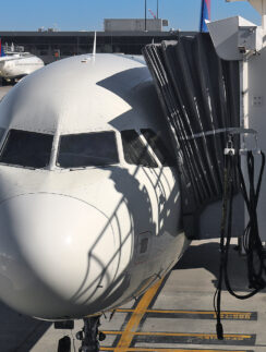 a white airplane at an airport
