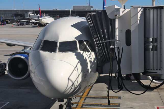 a white airplane at an airport