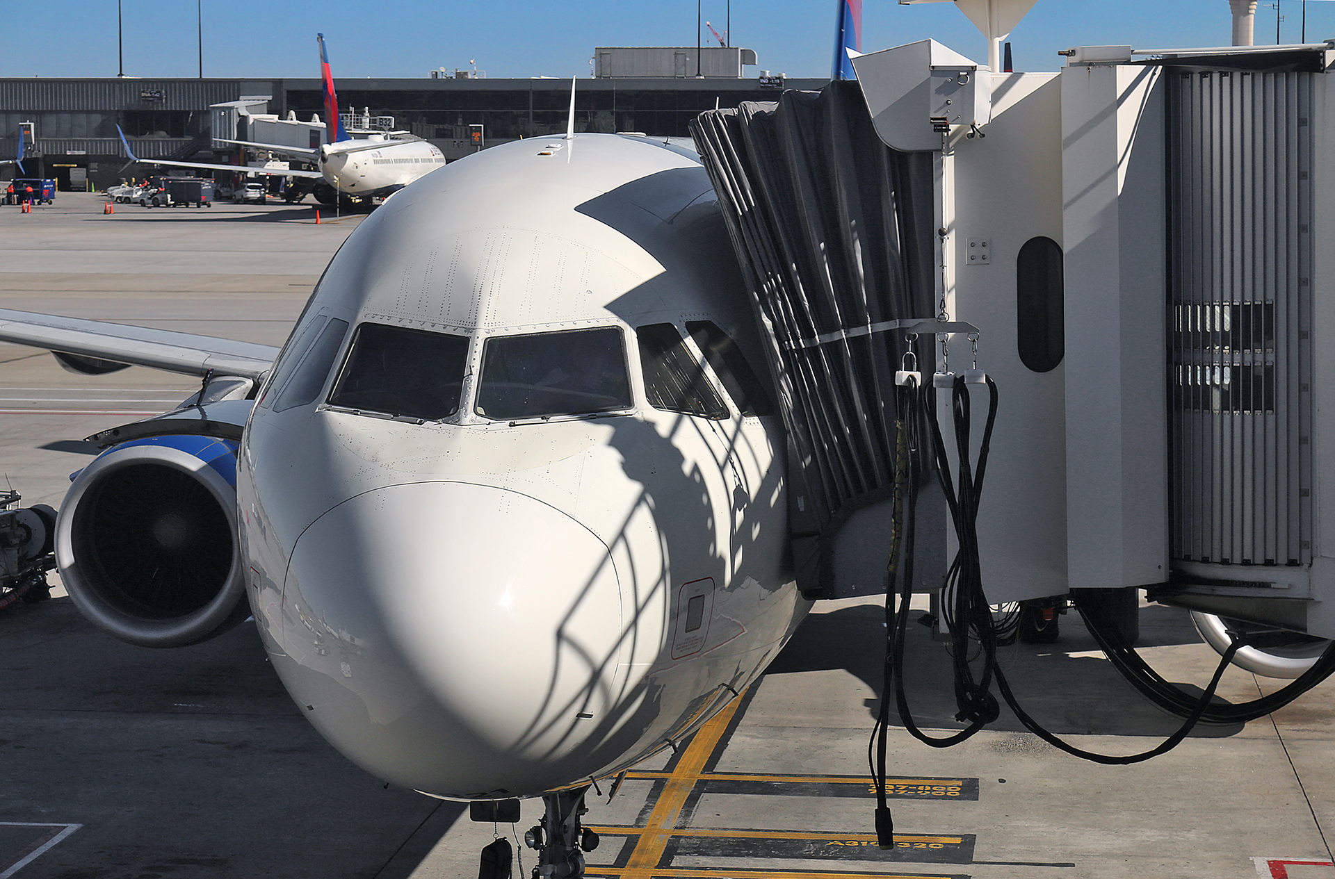 a white airplane at an airport