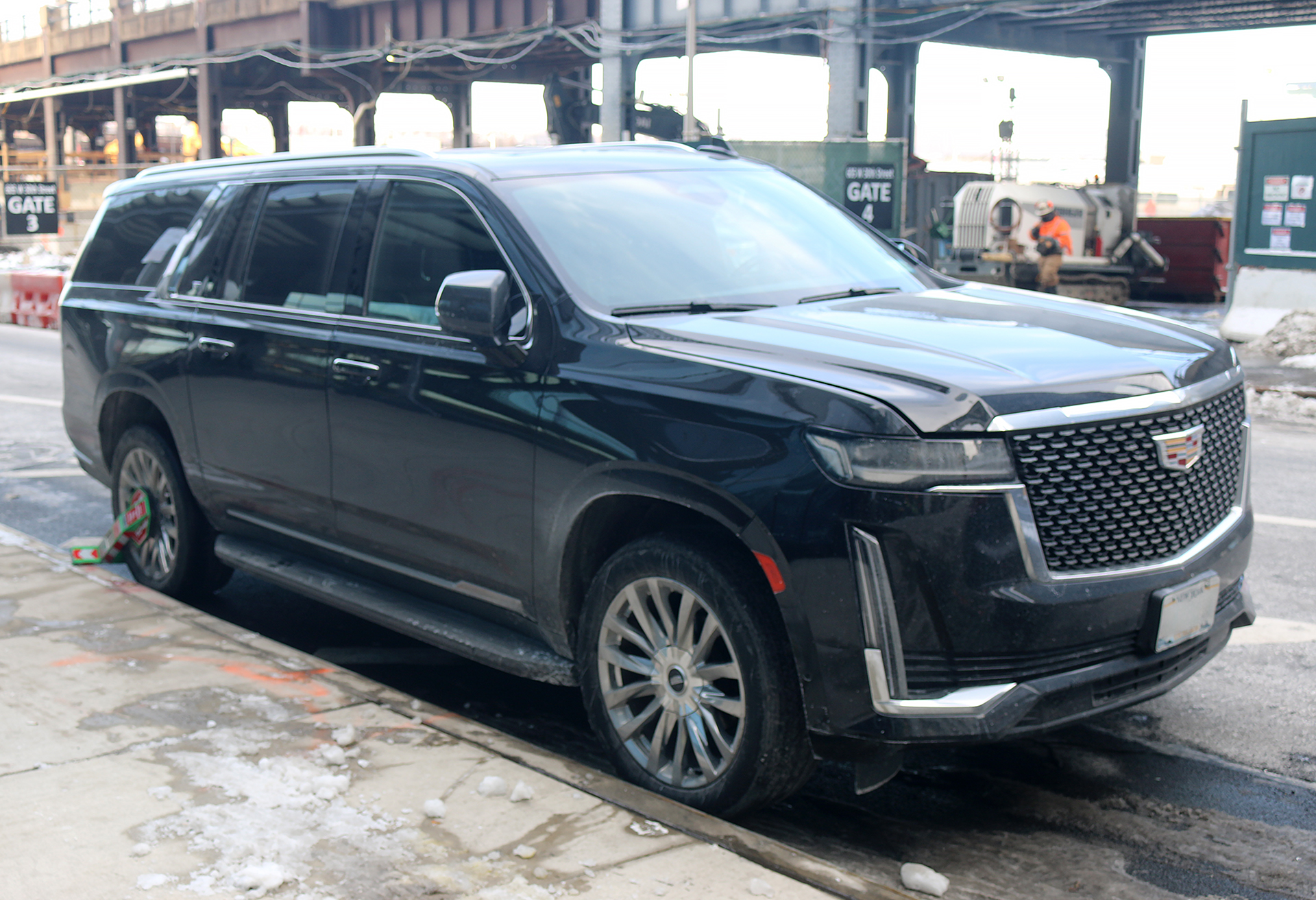 a black suv parked on a street