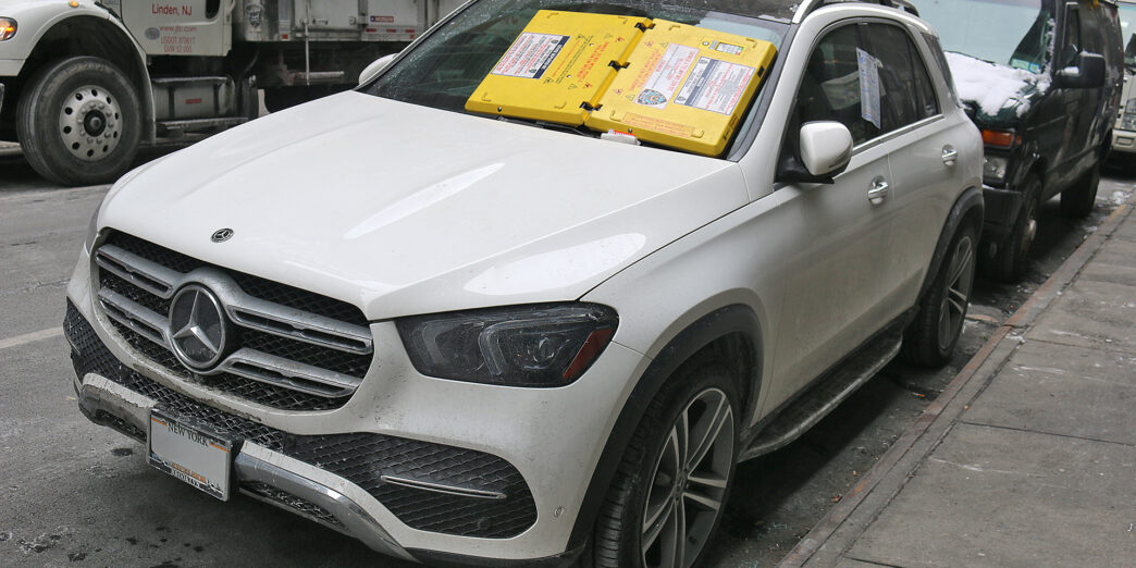 a white car parked on the side of the road