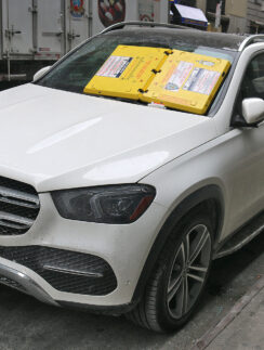 a white car parked on the side of the road