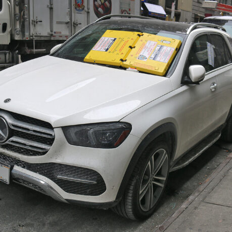 a white car parked on the side of the road