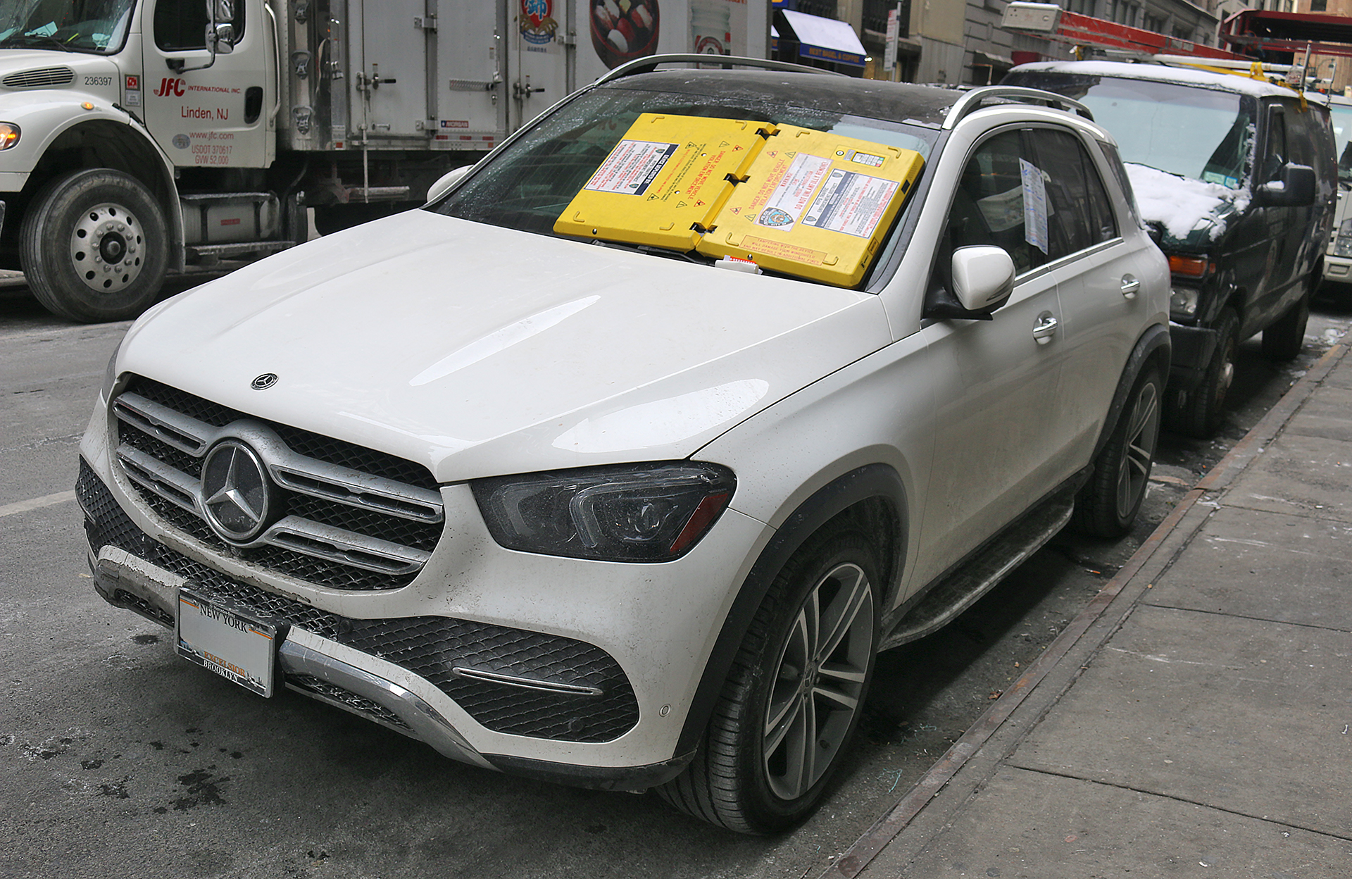 a white car parked on the side of the road