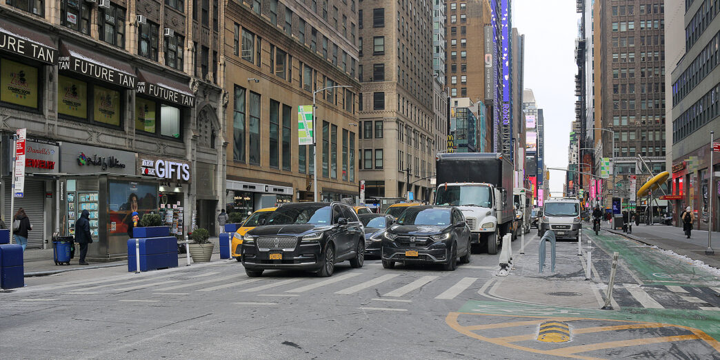 cars parked cars on a street in a city
