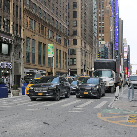 cars parked cars on a street in a city