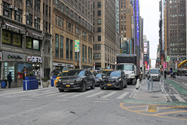 cars parked cars on a street in a city