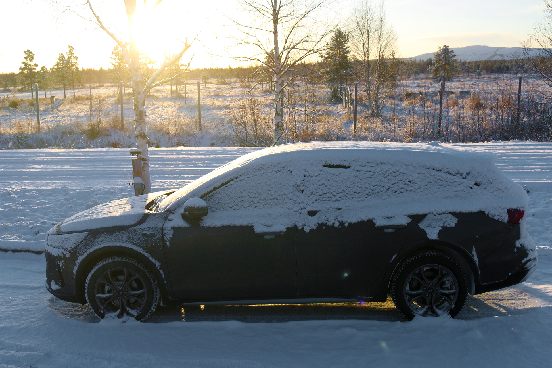 a car parked in the snow