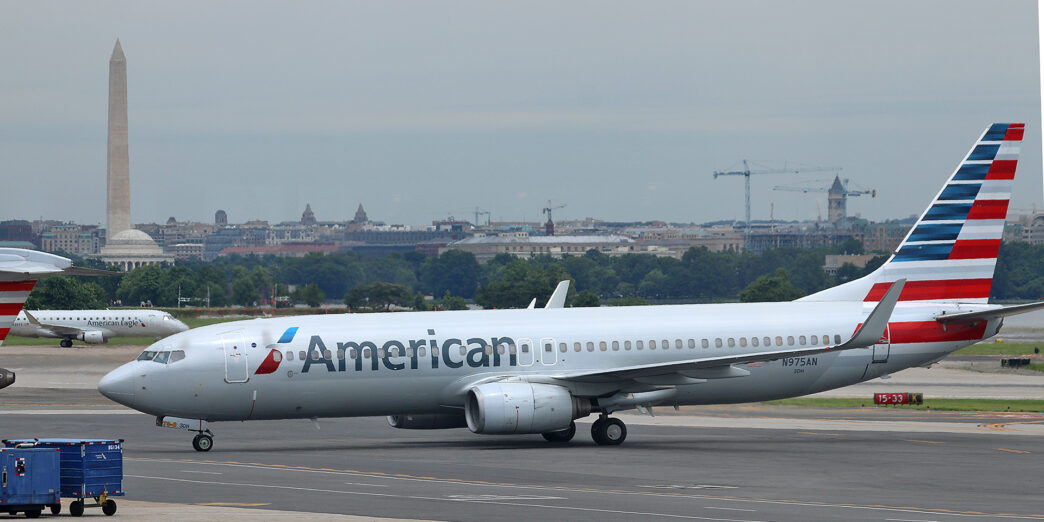 a white airplane on a runway