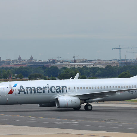 a white airplane on a runway