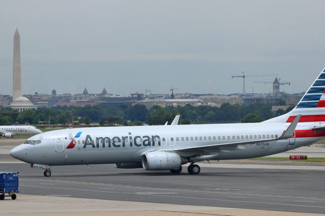 a white airplane on a runway
