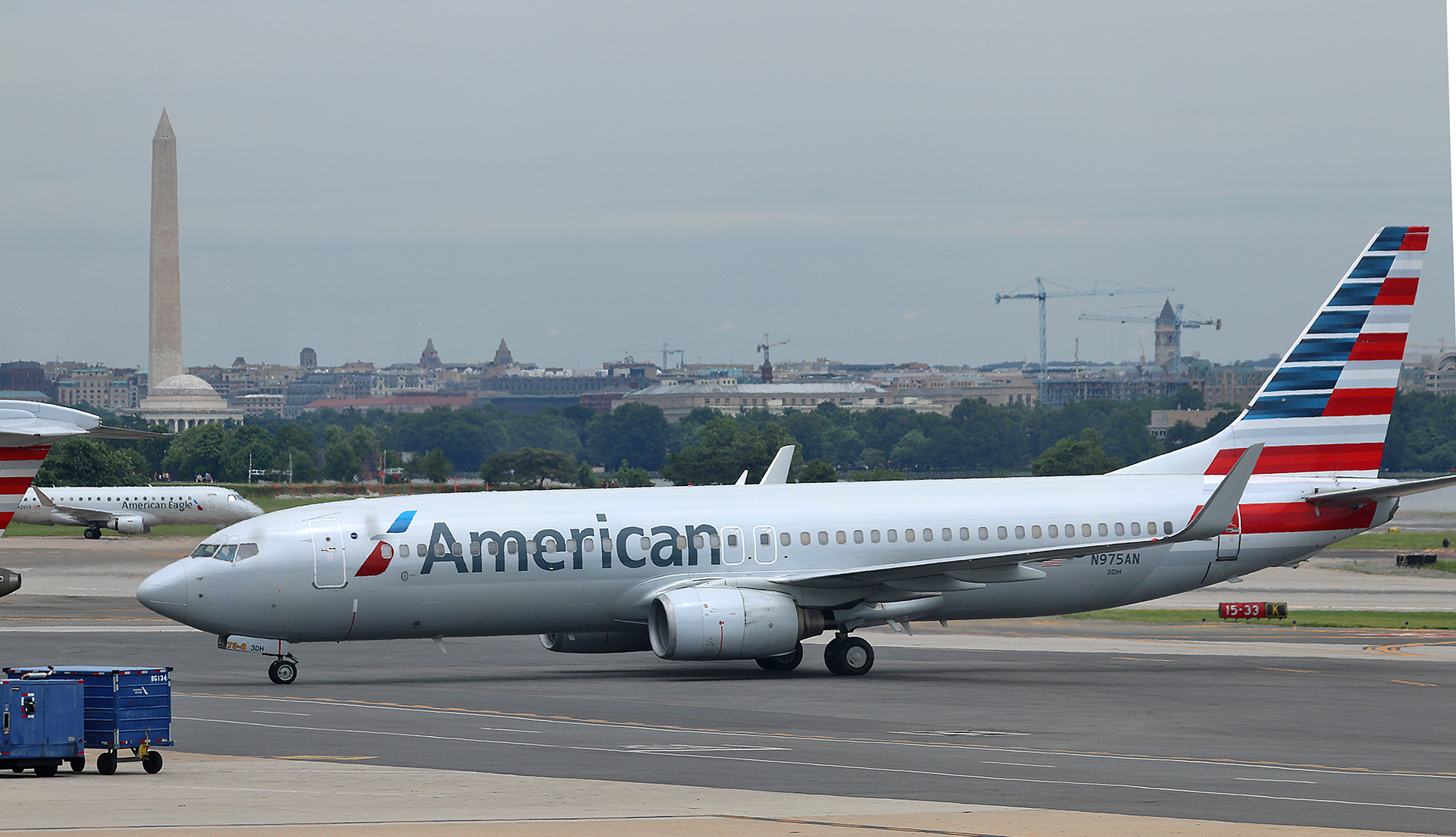 a white airplane on a runway