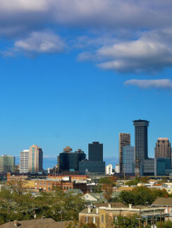 a city skyline with many buildings and trees