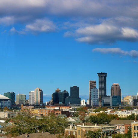 a city skyline with many buildings and trees