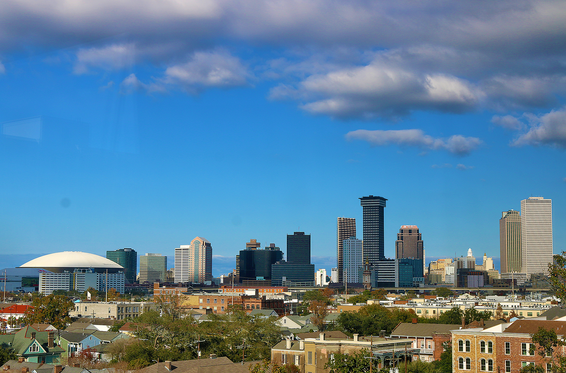 a city skyline with many buildings and trees