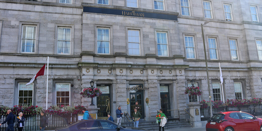 a building with people walking in front of it